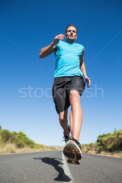 Fit man jogging on the open road Stock photo © wavebreak_media