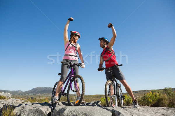 Fit cyclist couple cheering at the summit Stock photo © wavebreak_media