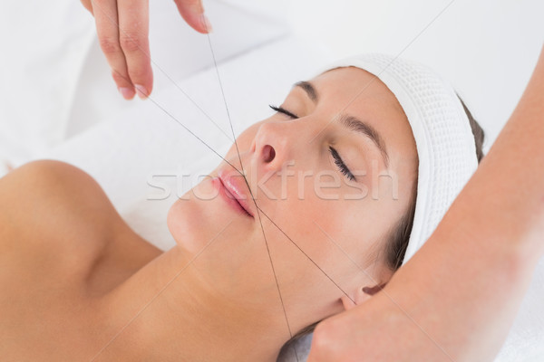 Hands threading beautiful womans upper lip Stock photo © wavebreak_media