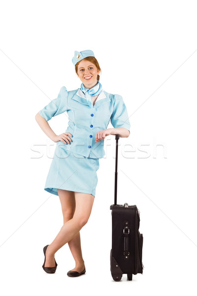 Pretty air hostess smiling at camera Stock photo © wavebreak_media