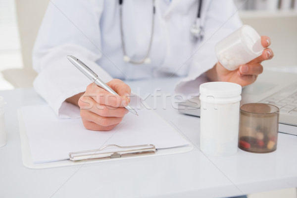 Veterinarian typing on keyboard the prescriptions  Stock photo © wavebreak_media