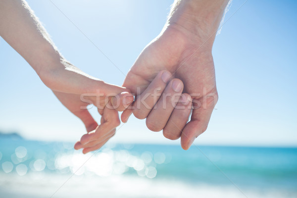 Pareja mano playa mujer hombre tomados de las manos Foto stock © wavebreak_media