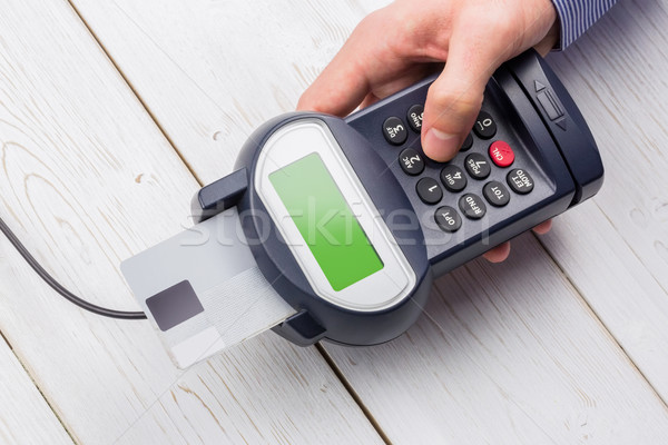 Man entering his pin on terminal Stock photo © wavebreak_media