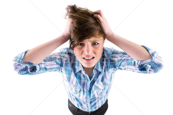 Pretty brunette getting a headache with hands on head Stock photo © wavebreak_media