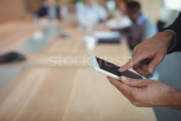 Cropped hands on businessman using digital tablet Stock photo © wavebreak_media