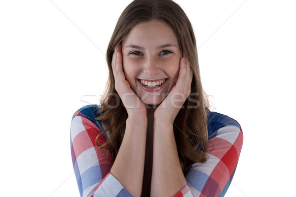 Smiling girl against white background Stock photo © wavebreak_media
