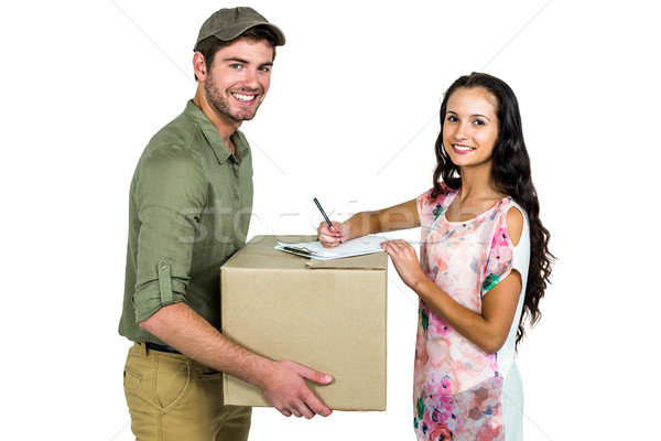 ストックフォト: 女性 · 署名 · パック · 配信 · 笑みを浮かべて · 郵便配達員