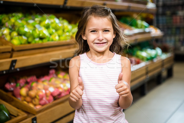 Portrait of little girl with thumps up  Stock photo © wavebreak_media
