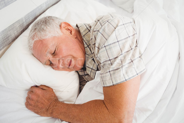 Senior homem adormecido cama quarto casa Foto stock © wavebreak_media