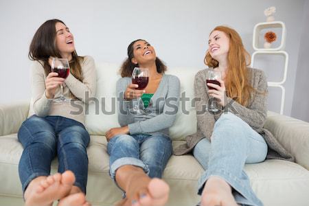 Jeunes Homme amis séance canapé [[stock_photo]] © wavebreak_media