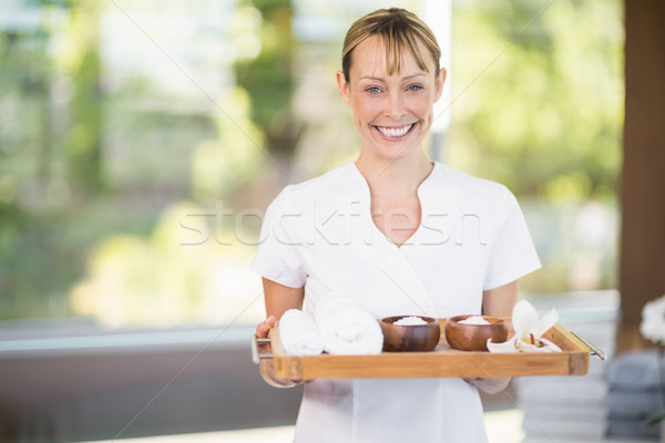 Stock photo: Female masseur with spa therapy products