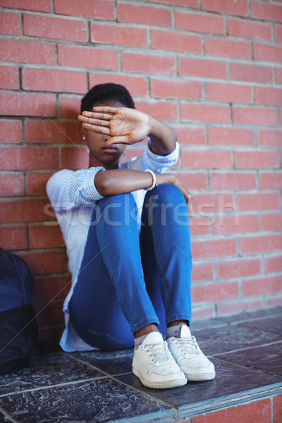 Szomorú iskolás lány arc kéz iskola kampusz Stock fotó © wavebreak_media