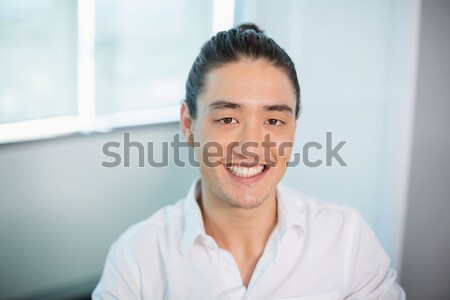 Smiling business executive sitting in office Stock photo © wavebreak_media