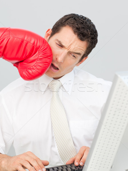 A businessman being boxed in his face Stock photo © wavebreak_media