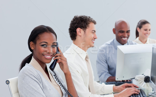 Sério equipe de negócios trabalhar escritório telefone teclado Foto stock © wavebreak_media