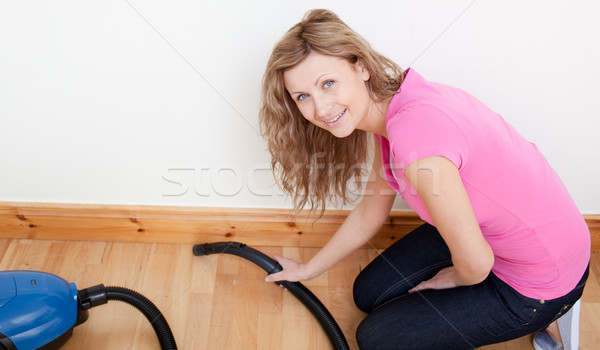 Portrait of a jolly woman vacuuming  Stock photo © wavebreak_media