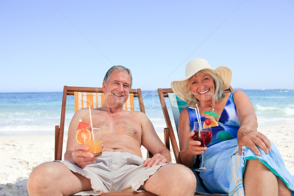 Casal de idosos sessão convés cadeiras água homem Foto stock © wavebreak_media