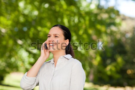 Woman phoning in the park Stock photo © wavebreak_media