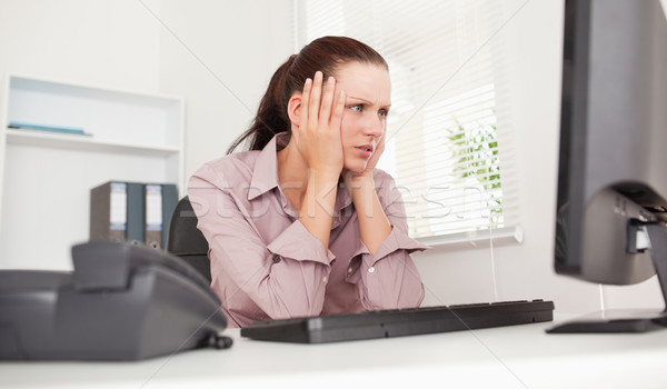 A stressed businesswoman is looking to the screen of her pc Stock photo © wavebreak_media
