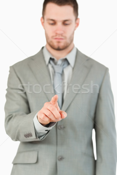 Businessman using futuristic touchscreen against a white background Stock photo © wavebreak_media