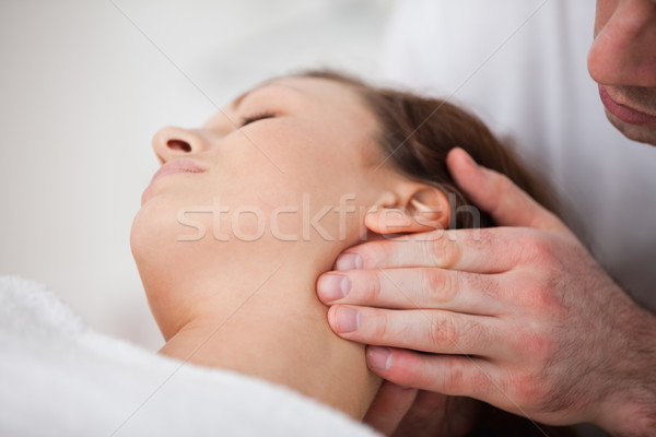 Close-up of woman being massaging by a physiotherapist in a room Stock photo © wavebreak_media
