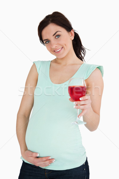 Young pregnant woman holding a mocktail against white background Stock photo © wavebreak_media