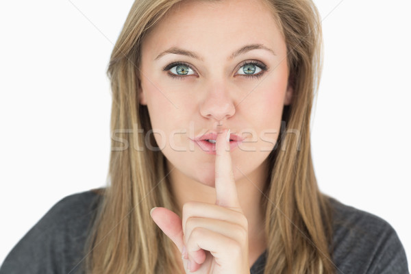 Blond vrouw vinger mond witte teken Stockfoto © wavebreak_media
