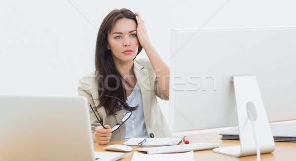 Casual business woman in front of computer at office Stock photo © wavebreak_media