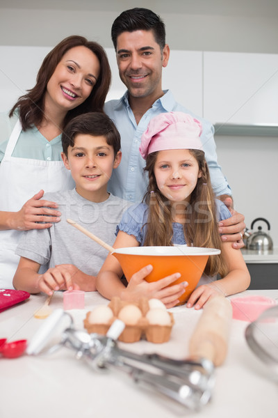 Portrait of a family of four preparing cookies in kitchen Stock photo © wavebreak_media