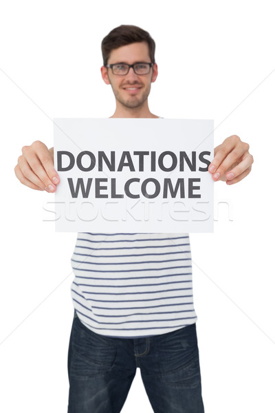 Portrait of a man holding a donation welcome note Stock photo © wavebreak_media