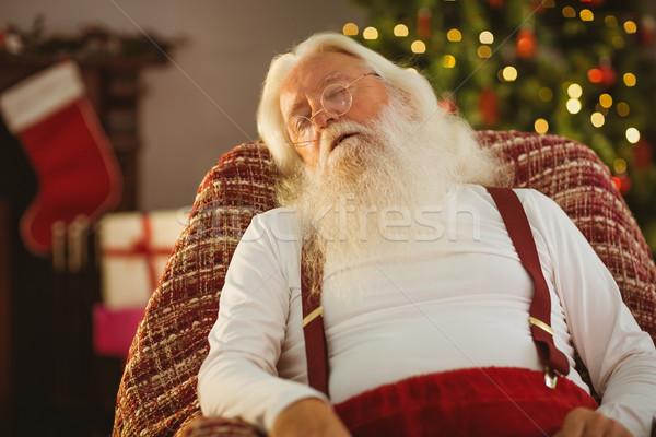 Santa claus sleeping on the armchair Stock photo © wavebreak_media