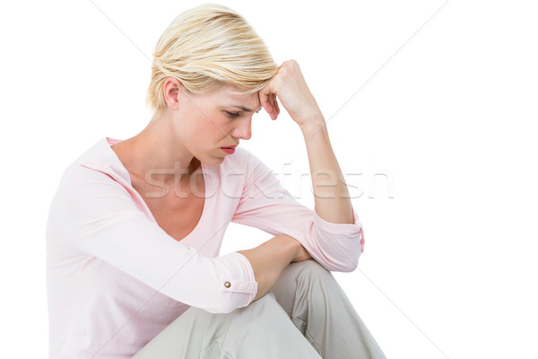 Depressed blonde woman sitting on the floor Stock photo © wavebreak_media