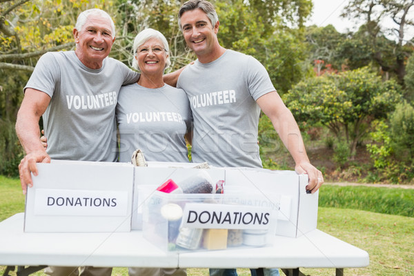 Happy family volunteer smiling at camera  Stock photo © wavebreak_media