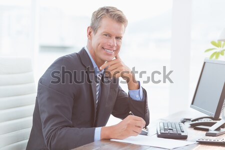 Happy businessman looking at the camera Stock photo © wavebreak_media