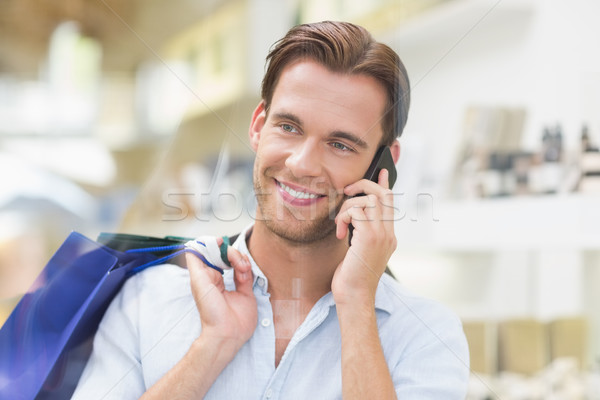 Feliz sonriendo hombre llamando centro comunicación Foto stock © wavebreak_media