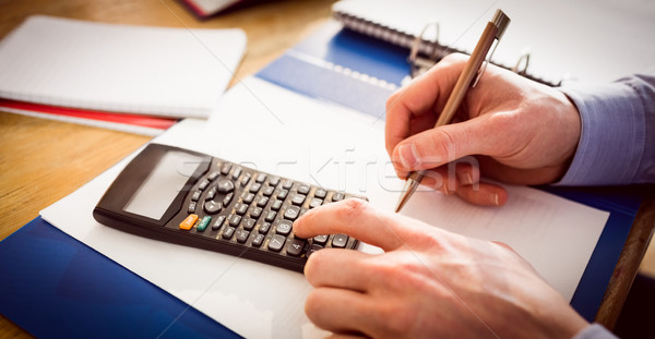 Businessman hands typing and writing Stock photo © wavebreak_media