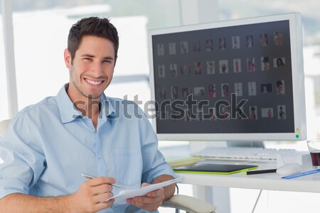 Shadowing a smiling businessman  Stock photo © wavebreak_media