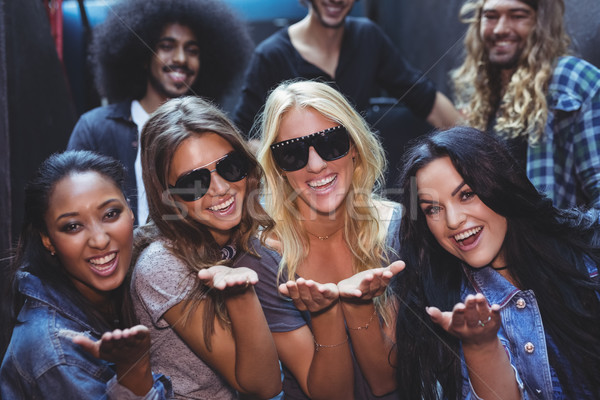 Portrait of women with male friends in background Stock photo © wavebreak_media