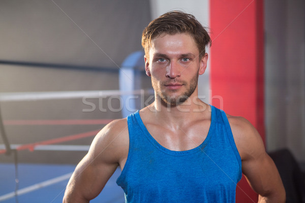 Portrait of young male athlete standing by boxing ring Stock photo © wavebreak_media