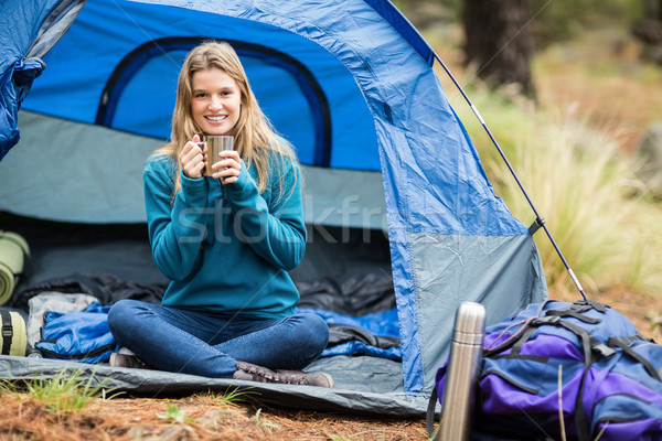 Portrait of a young pretty hiker sitting in a tent Stock photo © wavebreak_media