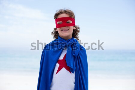 Zâmbitor fată superhero îndreptat aparat foto alb Imagine de stoc © wavebreak_media