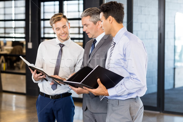 Stock photo: Business team with document and organizer