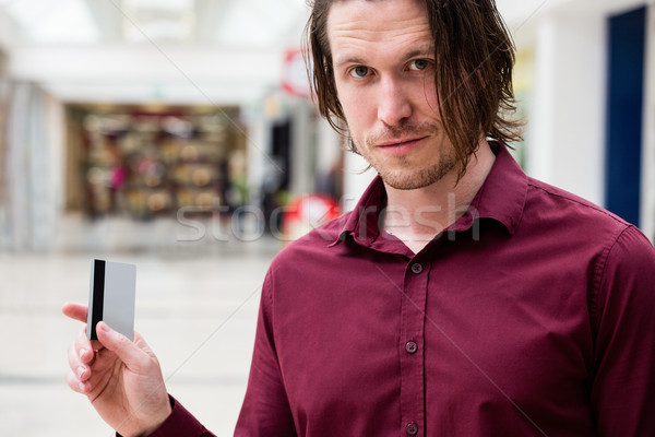 Portrait of man showing his credit card  Stock photo © wavebreak_media