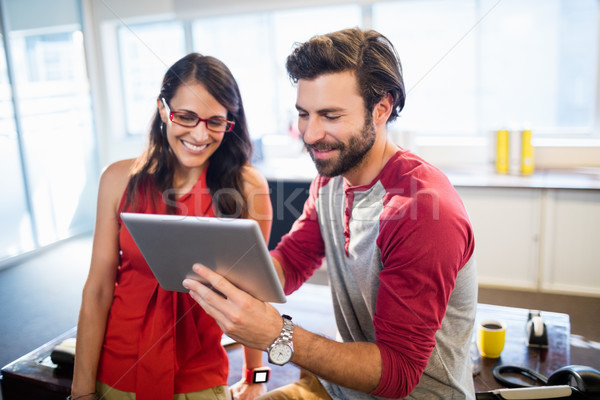 Colleagues using a tablet Stock photo © wavebreak_media