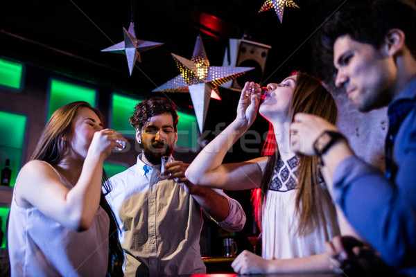 Grupy znajomych tequila restauracji kobieta bar Zdjęcia stock © wavebreak_media