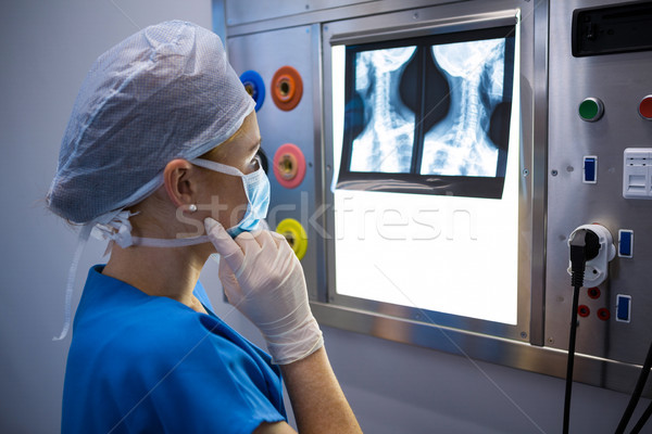 Female nurse examining x-ray on lightbox Stock photo © wavebreak_media