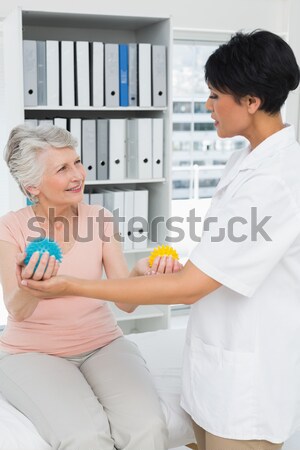 Female doctor checking blood pressure of a patient  Stock photo © wavebreak_media