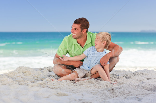 Stock photo: Attentive father with his son at the beach