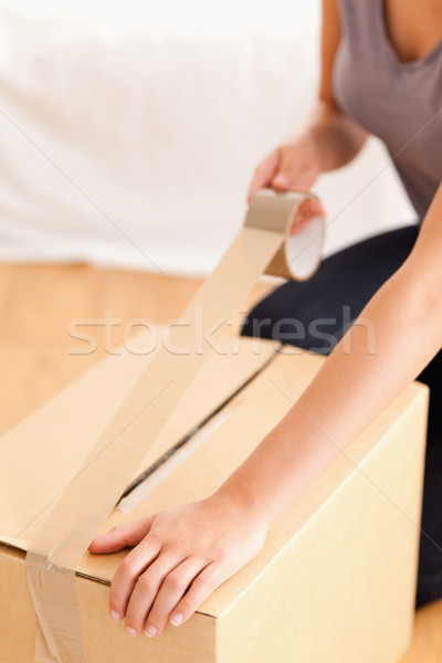 A close up of a female preparing a cardboard for transport Stock photo © wavebreak_media