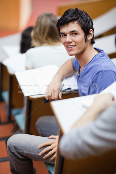 Portrait of a handsome young student being distracted in an amphitheater Stock photo © wavebreak_media